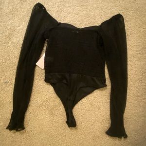 Black lacy comfortable onesie with long sleeves.